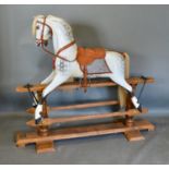 A Stevenson Brothers Carved Wooden Painted Rocking Horse upon wooden stand dated 1993, numbered