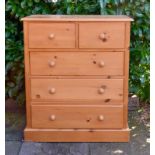 A 20th Century Pine Chest, the moulded top above two short and three long drawers with knob handles,