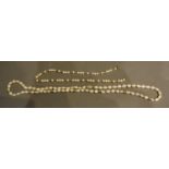 A 14 Carat Gold Pearl Necklace, together with a similar 18 carat gold pearl necklace