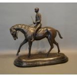 A 20th Century Patinated Bronze Model of a horse and rider upon shaped marble plinth, 39cm tall