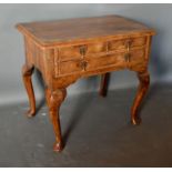 A George III Walnut Lowboy, the moulded crossbanded top above two short and one long drawer with