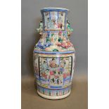 A 19th Century Canton Vase decorated in polychrome enamels with figures within landscapes, 34cm tall