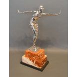 After Chiparus, a Silver Plated Art Deco Figure of a Dancing Girl upon stepped marble base, 49cm