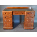 A Victorian Mahogany Inverted Twin Pedestal Desk, the green tooled leather inset top above nine