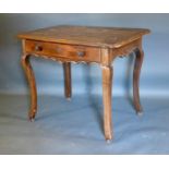A French Oak Side Table, the plank top above a frieze drawer with knob handles above a shaped frieze