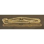 A Single Row Cultured Pearl Necklace with 9 carat white gold clasp, together with another cultured