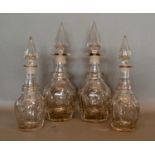 A Pair of 19th Century Glass Decanters with spire stoppers, together with a matching smaller pair,