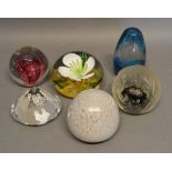A Caithness Glass Paperweight, Winter Rose, 100/500, together with five other similar paperweights