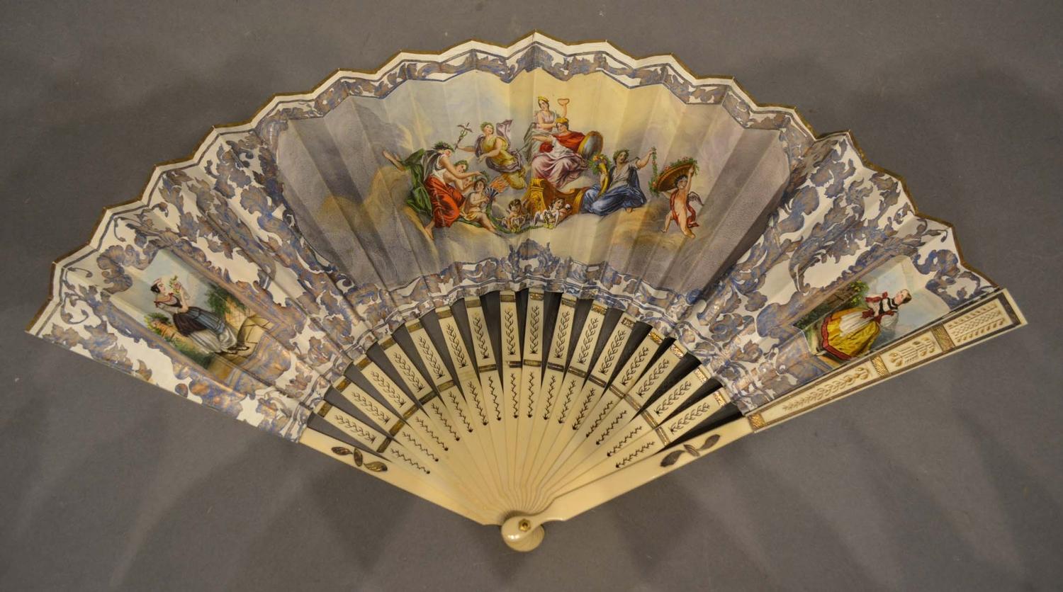 An 18th Century Spanish Fan with a lithograph depicting classical figures with blue and gilt on