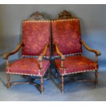 A Pair of Late 19th/Early 20th Century Italian Walnut Large Armchairs, each with a carved cresting