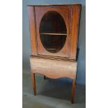 An Edwardian Mahogany Line Inlaid Side Cabinet with a hinged top above an oval glass panel raised