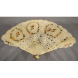 A 19th Century Silk Leafed Hand Painted Fan decorated with flowers and highlighted with gilt with