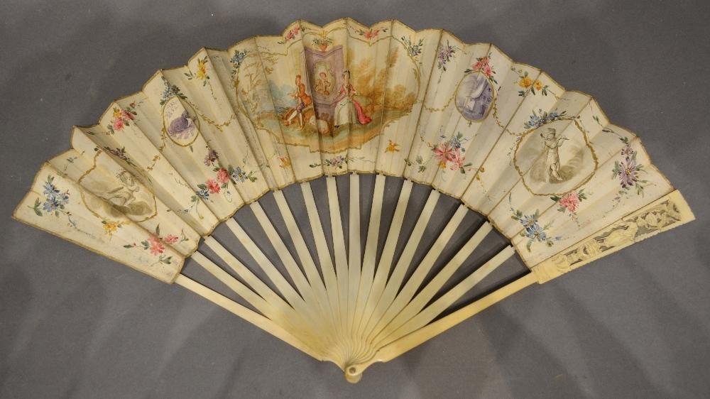 An Early 18th Century English Skin and Ivory Fan, hand painted with a central cartouche depicting