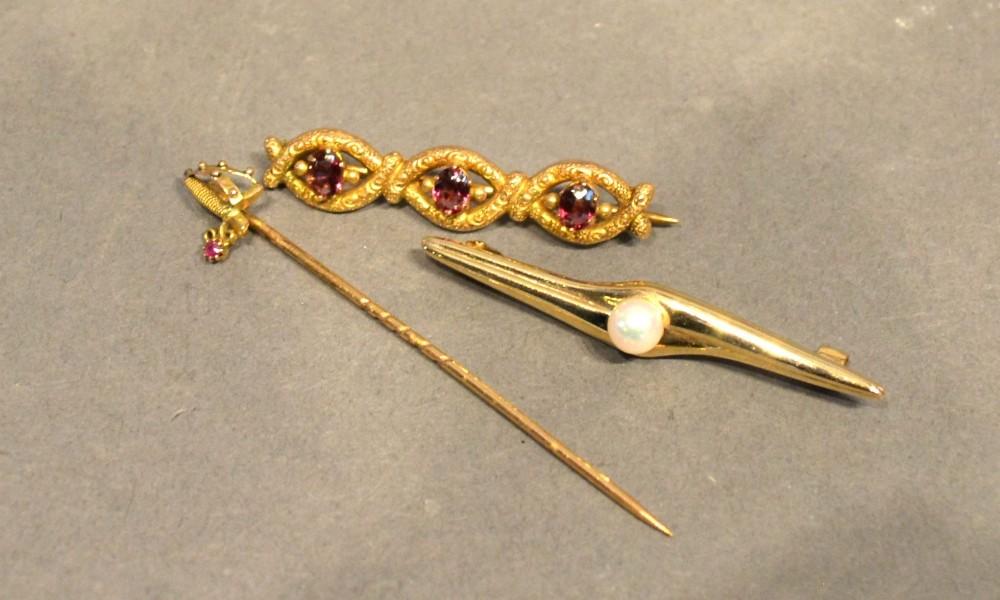 A 15 Carat Gold Triple Bar Brooch, garnet set, together with a similar pearl set bar brooch and a