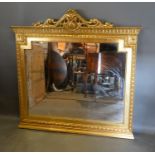 A French Style Gilded Large Overmantel Mirror, with pierced scroll cresting 137cm high by 140cm wide