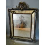 A 19th Century Fringe Gilded and Ebonised Cushion Wall Mirror with foliate pierced cresting, 125 x