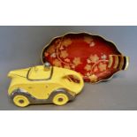 A Sadler Teapot in the form of a racing car, together with a Carlton Ware Rouge Royale oval dish