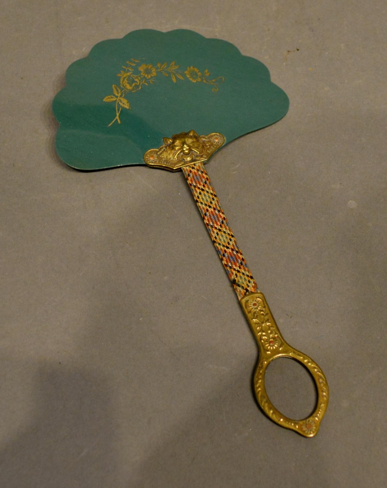 A French Fixed Fan with scalloped celluloid disc attached to a material covered flexible wood,