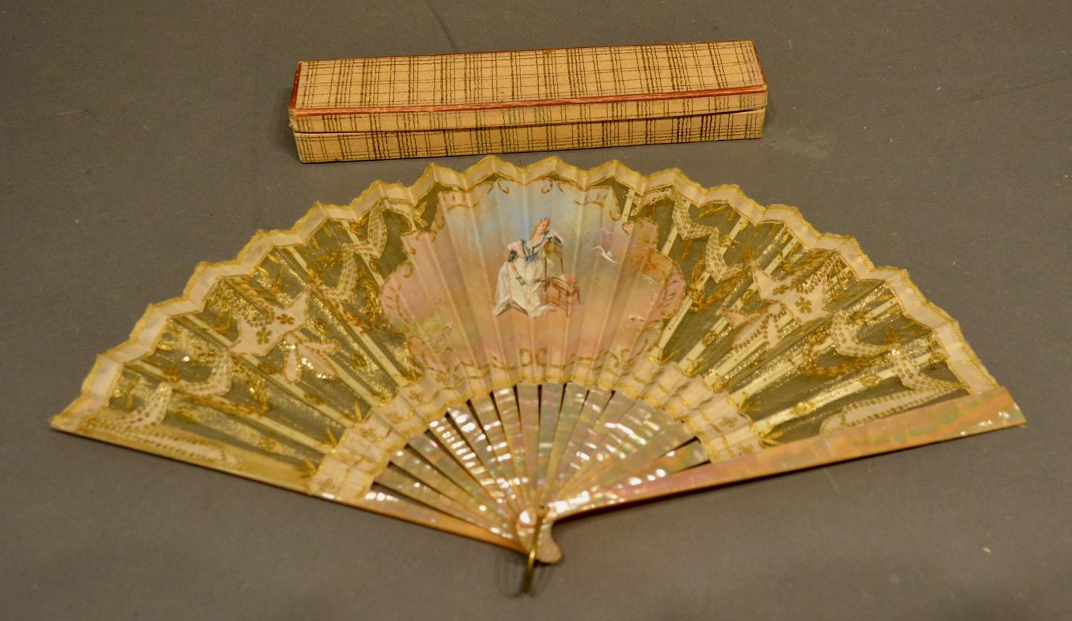 A 19th Century Mother of Pearl Fan, hand-painted with a cartouche depicting a figure and white