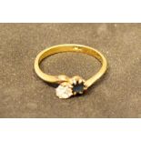 An 18 Carat Gold Sapphire and Diamond Crossover Ring, 2.5 grammes