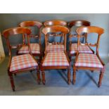 A Set of Six 19th Century Mahogany Dining Chairs, each with a carved rail back raised upon turned