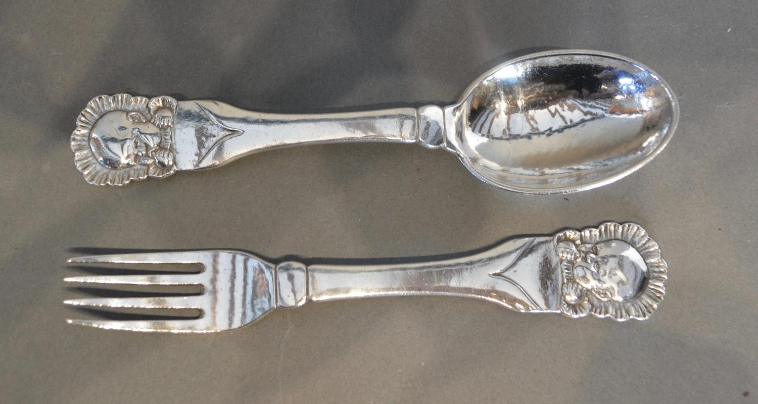Evald Nielsen, a Danish 830 Silver Christening Pair, 15cm long, together with a a Danish Sterling