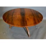 A Rosewood Circular Coffee Table with oustwept legs, 98cm diameter