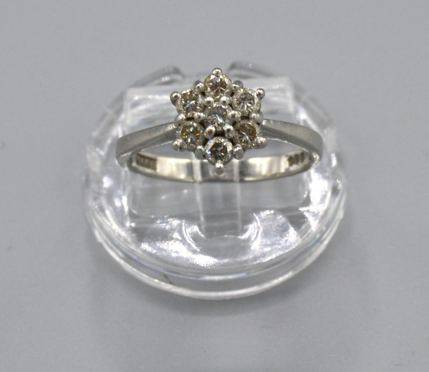 A Platinum Diamond Cluster Ring set with seven diamonds within a pierced setting, Size N, 4.5 grams - Image 2 of 2