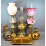 A Victorian Brass Oil Lamp with Opaque Glass Shade and Chimney together with another similar two