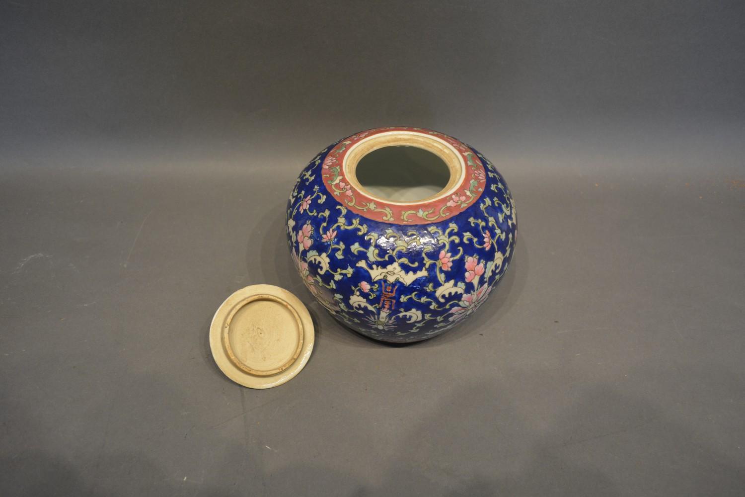 A Chinese Famille Rose Ginger Jar with allover decoration upon a blue ground and with four character - Image 3 of 3