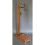 A Pair of Victorian Brass and Oak Jockey Scales by W & T Avery, Birmingham, 133cm tall