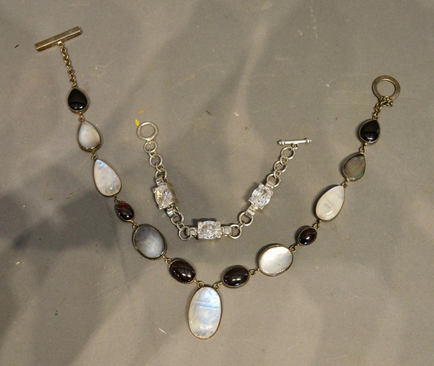 A 925 Silver Necklace, together with a similar 925 silver bracelet set clear stones