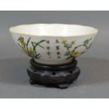 A 19th Century Chinese Porcelain Bowl, decorated in polychrome enamels and script, four character