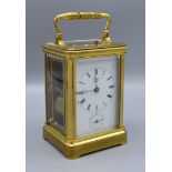 A Brass Carriage Clock by J W Benson, London, the enamel dial with Roman numerals and subsidiary