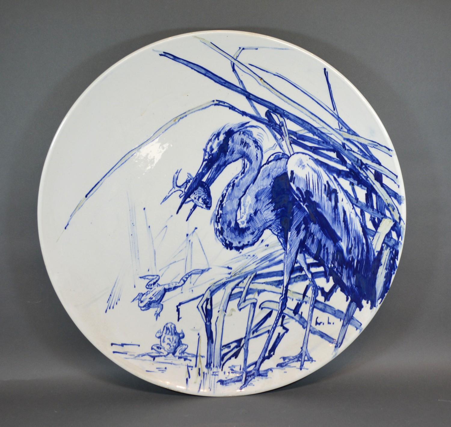 A Large Charger by TC Brown-Westhead Moore & Co decorated in blue and white with crane and frogs,