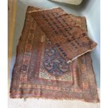 A Northwest Persian Woollen Rug with an all over design upon a blue, red and cream ground with