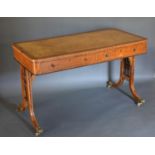 A Regency Style Walnut Ladies Writing Desk, the tooled leather inset top above two frieze drawers