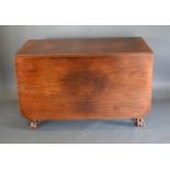 A 19th Century Mahogany Drop Flap Dining Table with an end drawer raised upon cabriole legs with