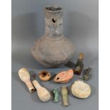 An Early Terracotta Oil Lamp together with a collection of related items