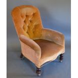 A Victorian Upholstered Button-Backed Armchair with Turned Legs