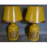 A Pair of Toleware Table Lamps in the form of canisters with armorial crests and highlighted with