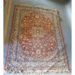 A Northwest Persian Style Woollen Rug with a central medallion within an all over design upon a