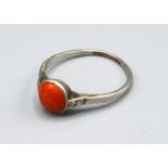 A White Metal Ring set with Central Cabochon Coral and with Diamond shoulders, Size P, 2 grams