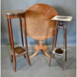 A 19th Century Mahogany Circular Pedestal Table, together with two Edwardian mahogany torcheres