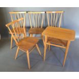 A Set of Four Ercol Beech and Elm Dining Chairs each with a spindle back upon a panel seat, raised