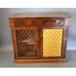 A 19th Century Mahogany Chiffonier with a frieze drawer above two brass grilled doors raised upon