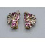 A Pair of Yellow Metal Ear Clips of Foliate Spray Form set with diamonds and rubies 2.8cm long, 8.