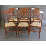 A Set of Six Edwardian Satinwood Crossbanded Side Chairs, each with a pierced crossover back above a