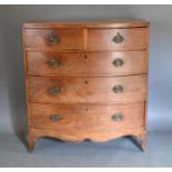 A 19th Century Mahogany Bow-fronted Chest of two short and three long drawers with oval brass