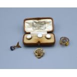 A 9ct Gold and Enamel Set British Legion Badge together with two other badges and a set of three